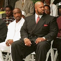 Is Pac sitting next to the man responsible for his Death?